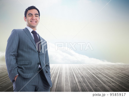 Composite image of smiling businessman standing Composite image of smiling businessman standing 9585917