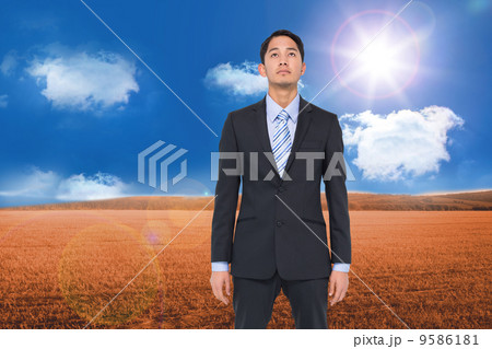Composite image of serious asian businessman 9586181