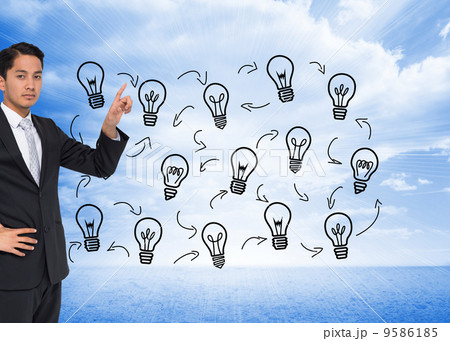 Composite image of unsmiling asian businessman pointing Composite image of unsmiling asian businessman pointing 9586185