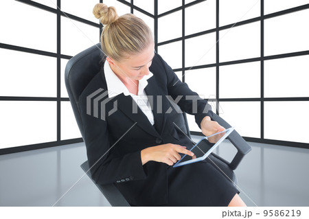 Composite image of businesswoman sitting on swivel chair with ta 9586219