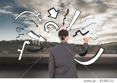 Composite image of businessman standing back to camera writing w 9586222