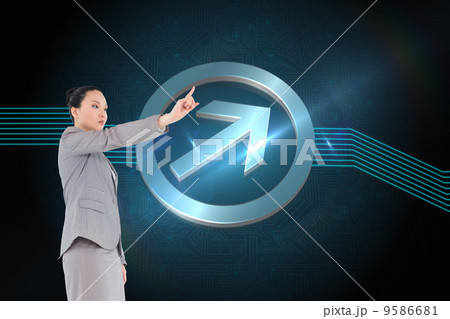 Composite image of unsmiling asian businesswoman pointing 9586681