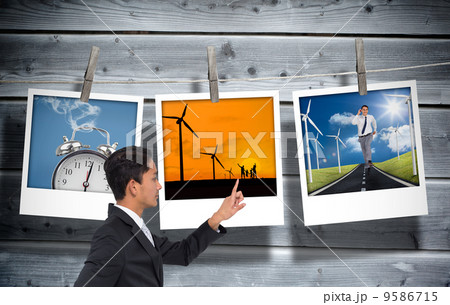 Composite image of unsmiling asian businessman pointing Composite image of unsmiling asian businessman pointing 9586715