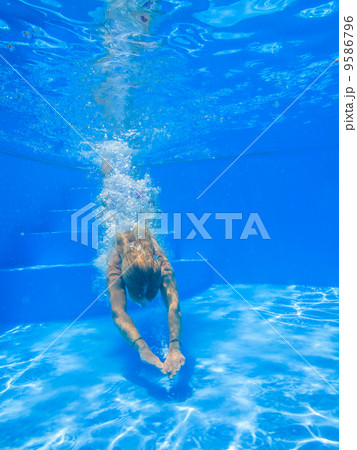 Underwater woman in swimming pool. Underwater woman in swimming pool. 9586796