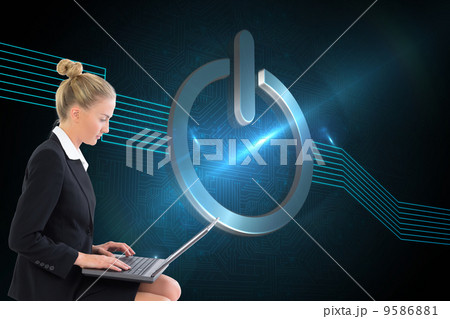 Composite image of businesswoman using laptop 9586881