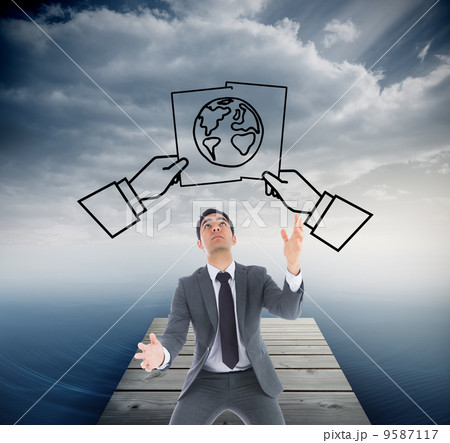 Composite image of unsmiling businessman catching Composite image of unsmiling businessman catching 9587117