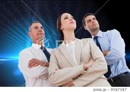 Composite image of serious work team posing together looking awa Composite image of serious work team posing together looking awa 9587387