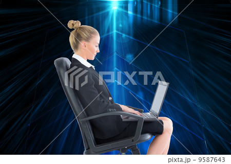 Composite image of businesswoman sitting on swivel chair with la Composite image of businesswoman sitting on swivel chair with la 9587643