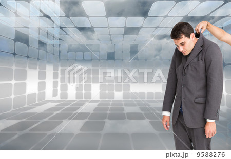 Composite image of businessman hanging 9588276