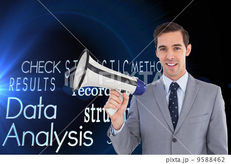 Composite image of smiling businessman holding a megaphone 9588462