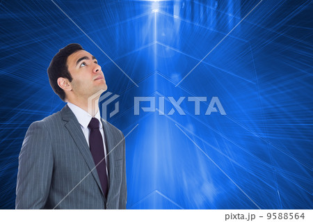 Composite image of unsmiling businessman standing 9588564