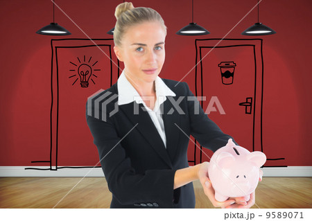 Composite image of businesswoman holding piggy bank 9589071