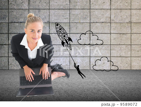 Composite image of businesswoman using laptop 9589072