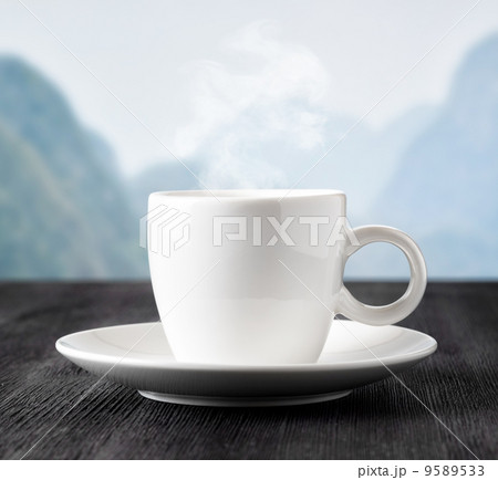 Cup of coffee on highlands background 9589533