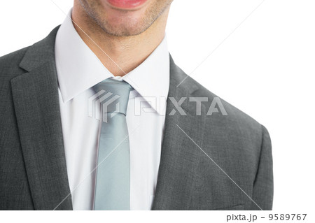 Mid section of businessman wearing blue tie 9589767