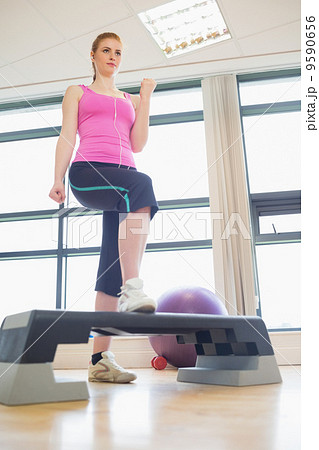Woman at aerobics class in gym Woman at aerobics class in gym 9590656