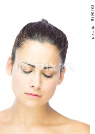 Front view of unhappy brunette woman having the eyes closed 9590732