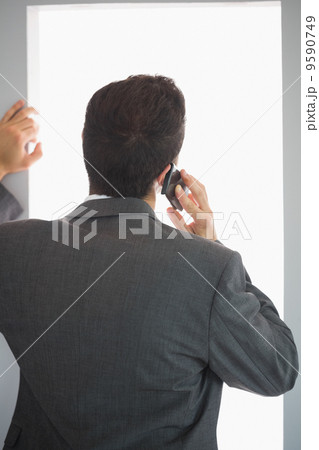 Rear view of businessman phoning Rear view of businessman phoning 9590749