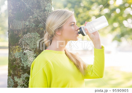 Fit peaceful blonde drinking from water bottle Fit peaceful blonde drinking from water bottle 9590905