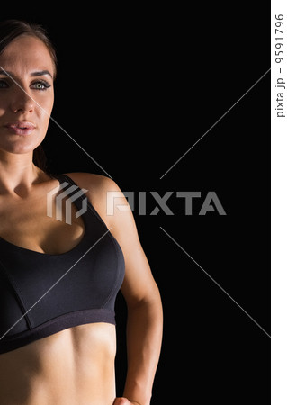 Attractive brunette woman wearing sportswear posing Attractive brunette woman wearing sportswear posing 9591796