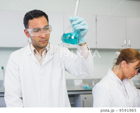 Researcher experimenting in the lab Researcher experimenting in the lab 9591965