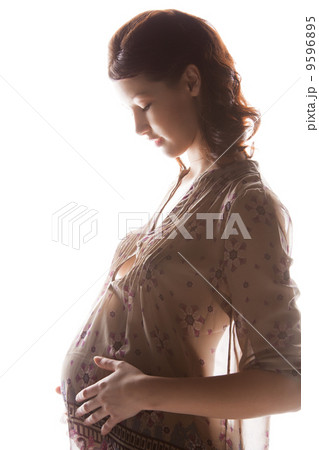 silhouette picture of pregnant beautiful woman 9596895