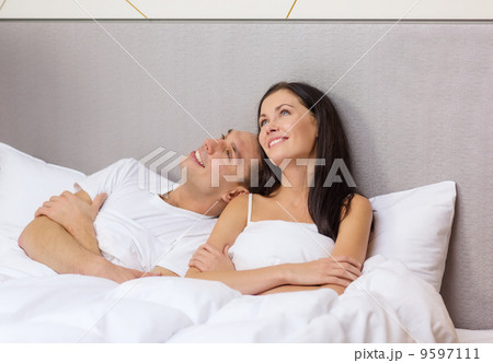 happy couple dreaming in bed happy couple dreaming in bed 9597111