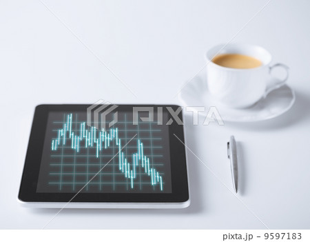 tablet pc with forex chart on it and cup of coffee tablet pc with forex chart on it and cup of coffee 9597183