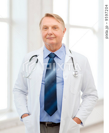smiling doctor or professor with stethoscope 9597204