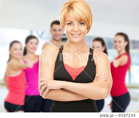 group of smiling people exercising in the gym 9597234