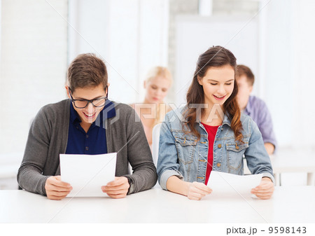 two teenagers looking at test or exam results 9598143