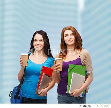 two students with bag, folders, tablet and coffee 9598208