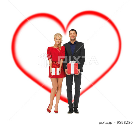 smiling man and woman with gift boxes smiling man and woman with gift boxes 9598280
