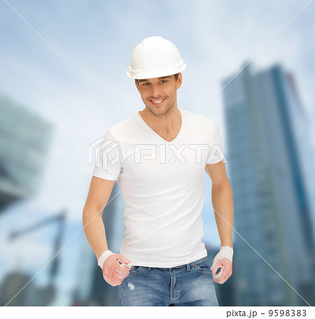 handsome builder in white helmet handsome builder in white helmet 9598383