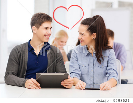 students looking at tablet pc in lecture at school students looking at tablet pc in lecture at school 9598621