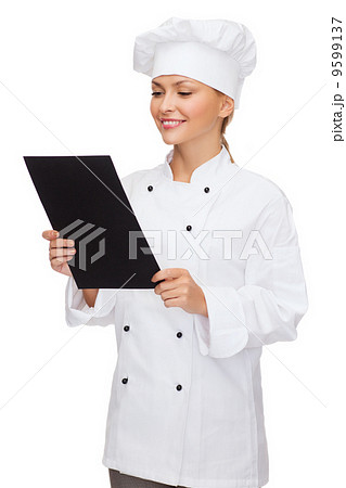 smiling female chef with black blank paper 9599137