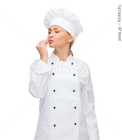 smiling female chef showing delicious sign smiling female chef showing delicious sign 9599191