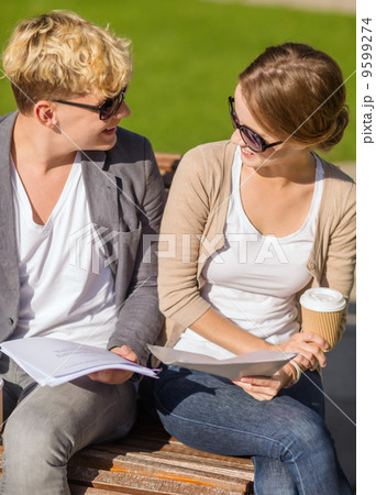 two students with books, notebooks and folders two students with books, notebooks and folders 9599274