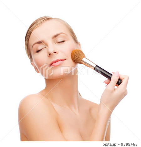 beautiful woman with makeup brush 9599465