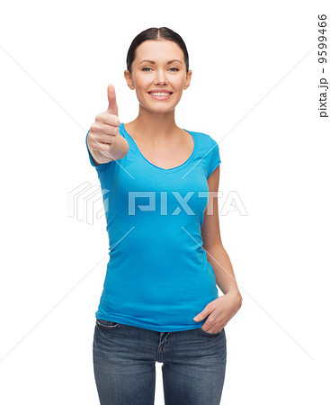 smiling girl in blue t-shirt showing thumbs up smiling girl in blue t-shirt showing thumbs up 9599466