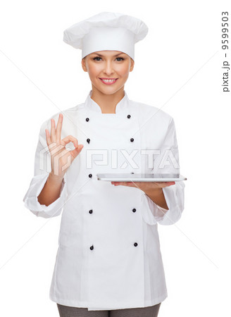 smiling female chef with tablet pc computer smiling female chef with tablet pc computer 9599503