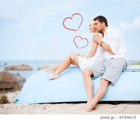 couple sitting on boat at sea side couple sitting on boat at sea side 9599615