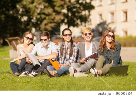 students or teenagers with laptop computers students or teenagers with laptop computers 9600234