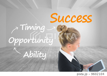 Composite image of businesswoman holding new tablet 9602104