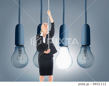 Composite image of businesswoman pulling a chain 9602112