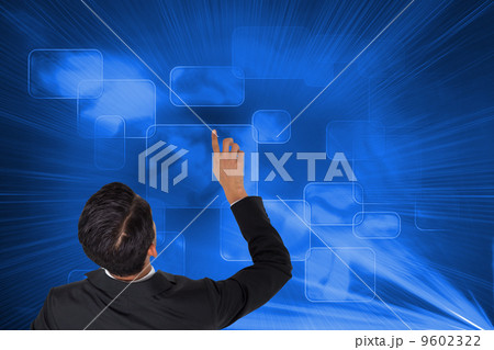 Composite image of asian businessman pointing 9602322