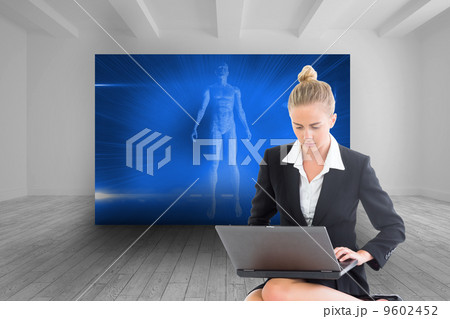 Composite image of businesswoman using laptop Composite image of businesswoman using laptop 9602452