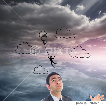 Composite image of unsmiling businessman catching Composite image of unsmiling businessman catching 9602495