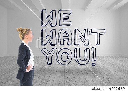 Composite image of businesswoman standing with hands on hips 9602629