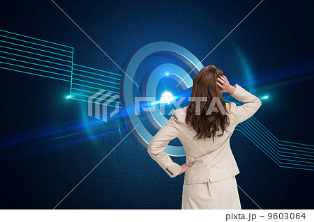 Composite image of businesswoman standing back to camera with ha 9603064